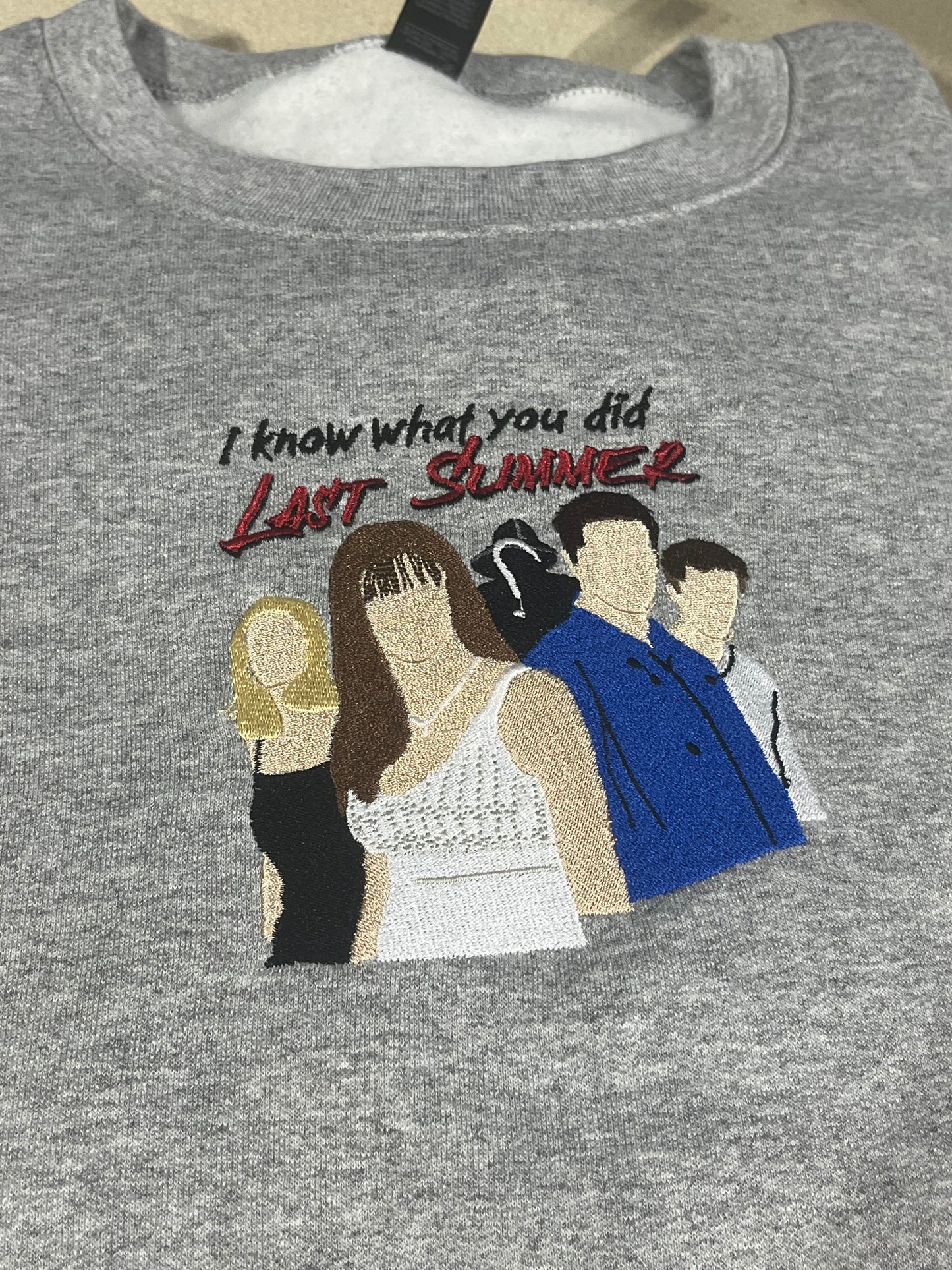 I know embroidered Crewneck